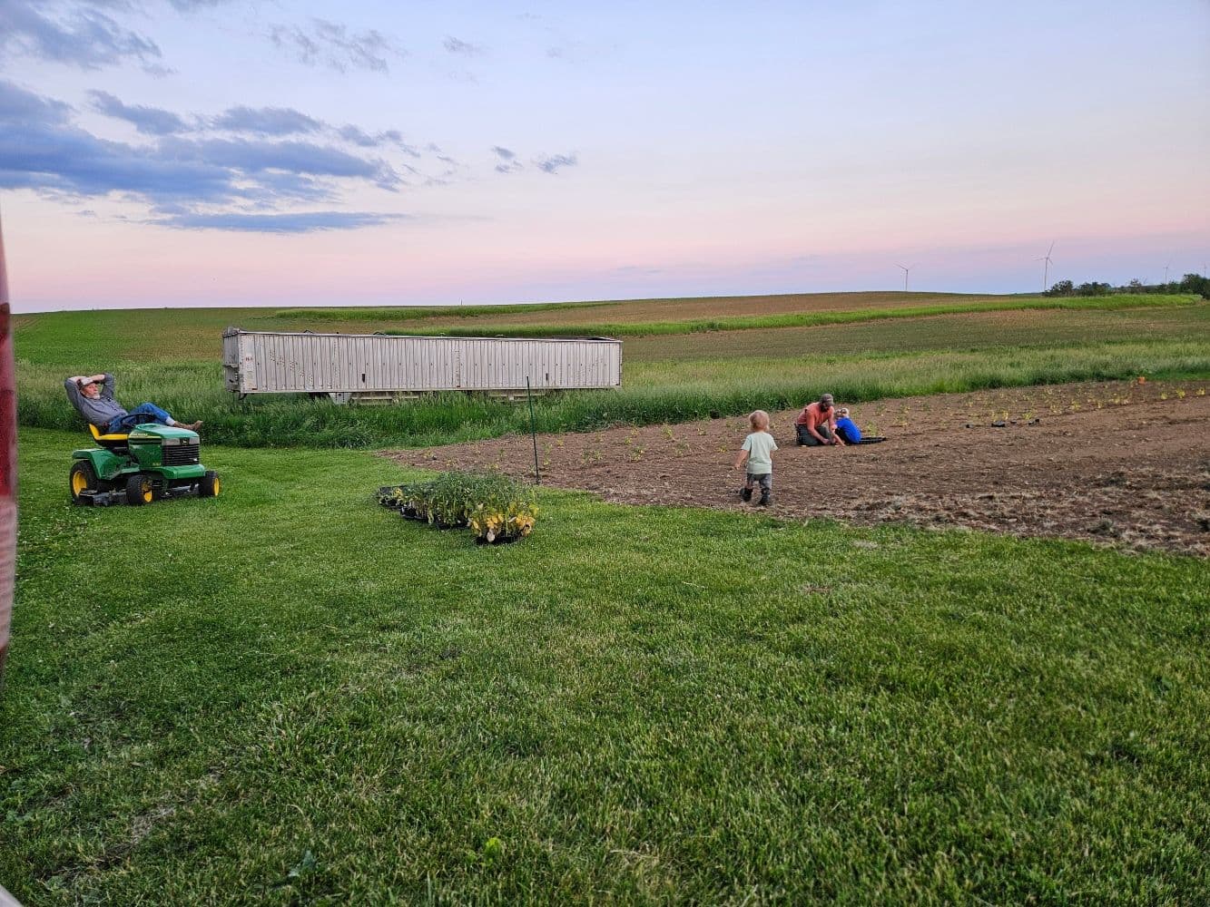 family hanging out in field